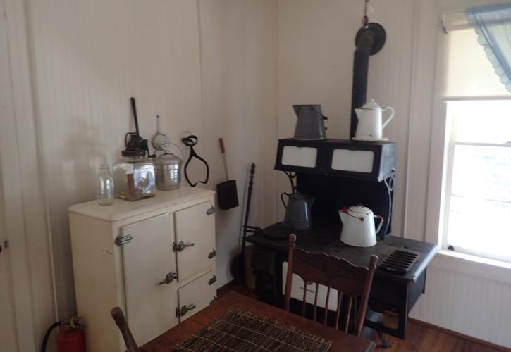 A view of the Matheson house kitchen, complete with wood burning stove and icebox.